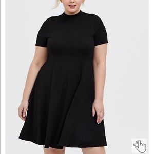 Torrid black mock necked fluted mini dress. Size 14-16 (torrid size 1)